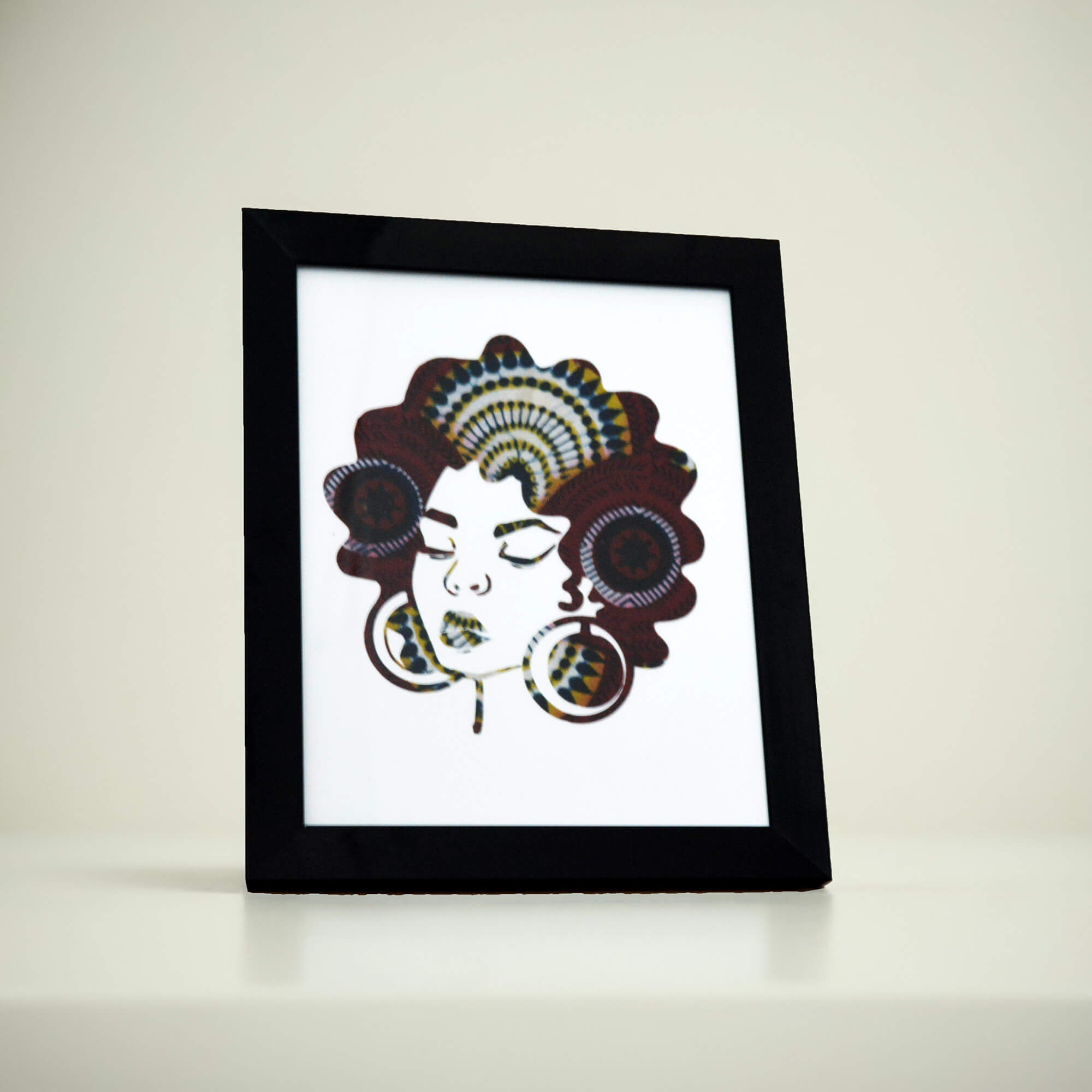 black woman with afro hair and large earrings ecoresponsible poster made of african fabric scap