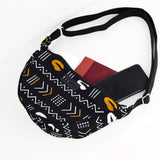 Cowrie African print belt bag - black, white & orange