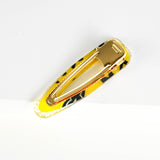 yellow and black teardrop barrette