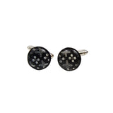 boutons de manchette noirs et blancs avec un motif de cauris