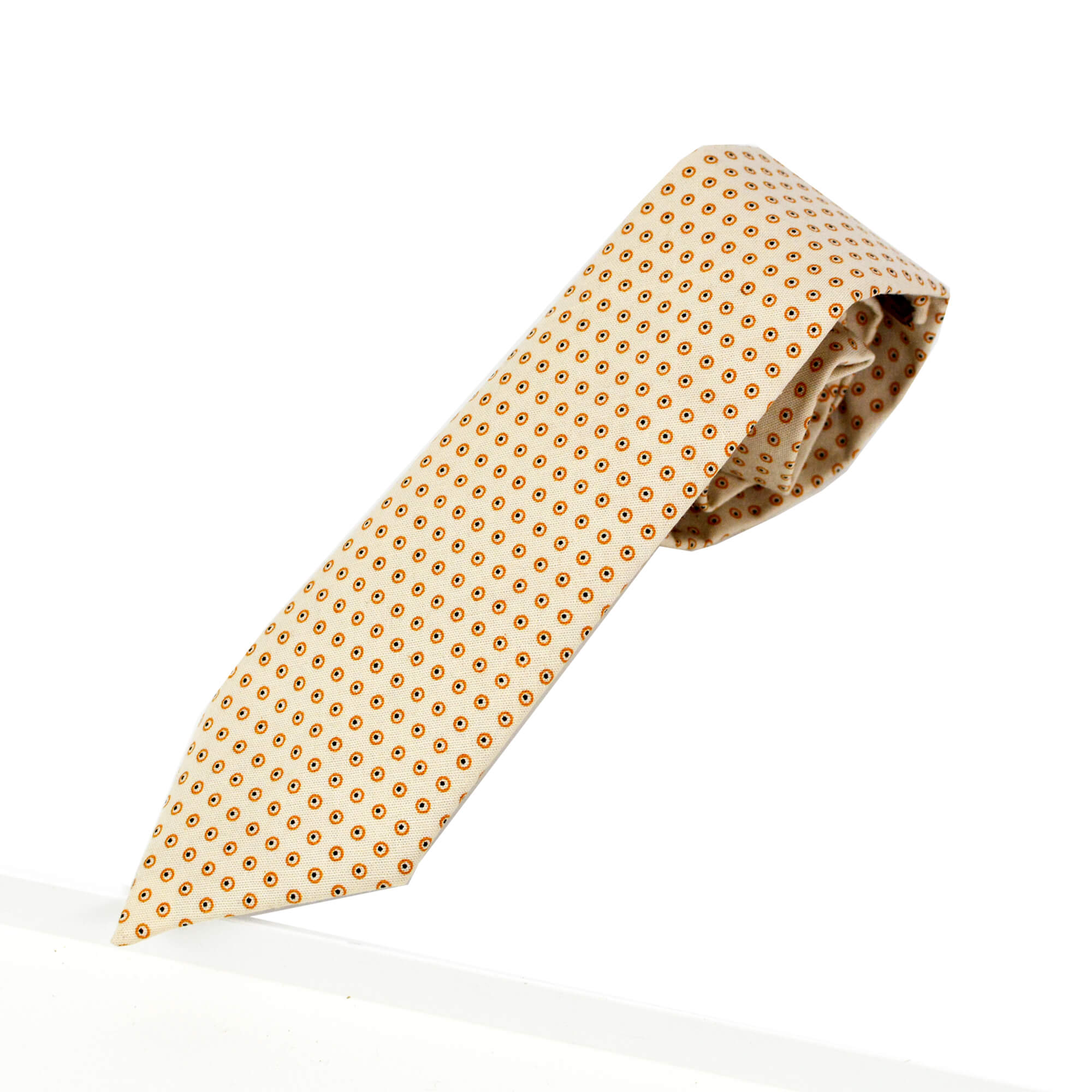 Cravate beige à pois cerclés dorés et points noirs