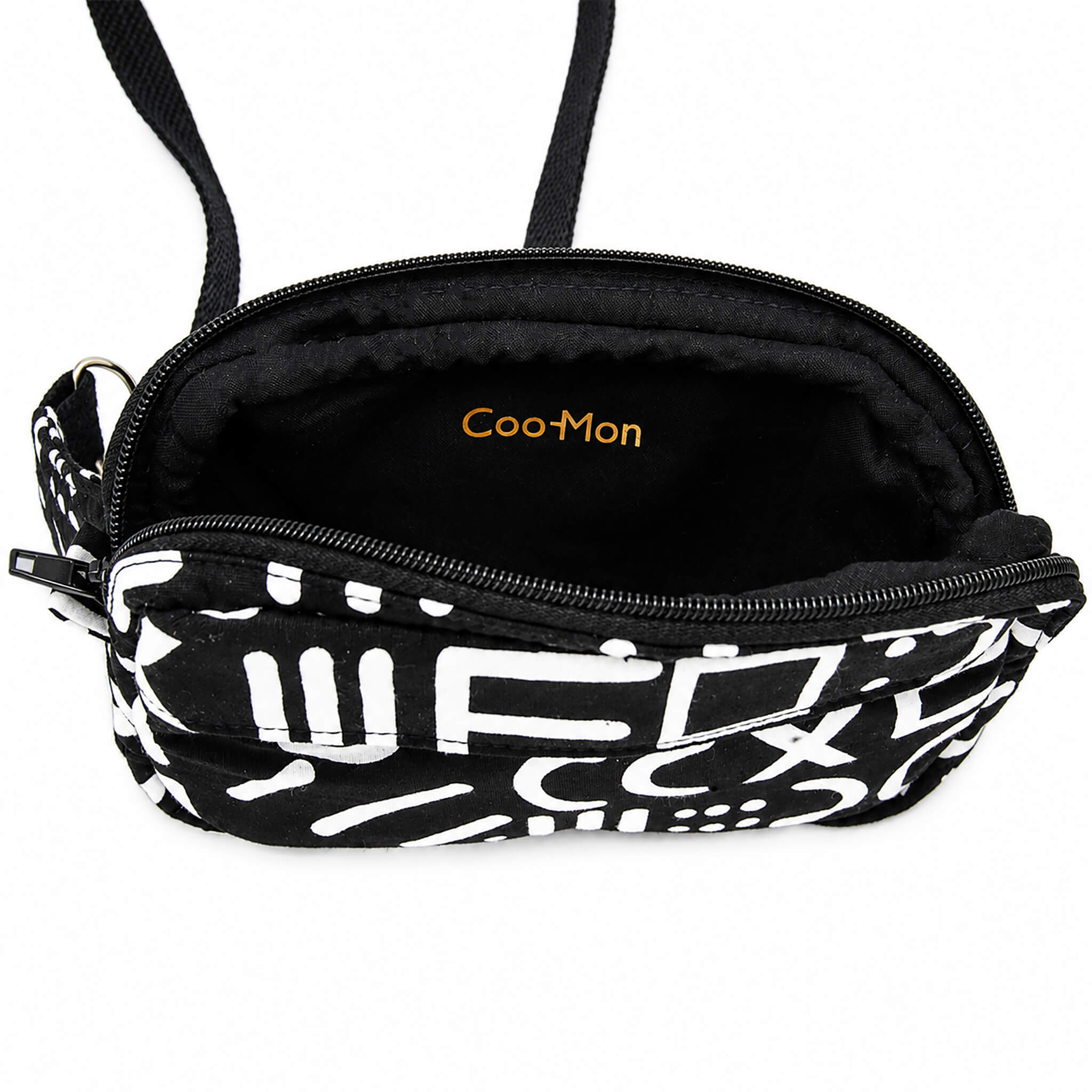 Intérieur d'un sac bandoulière noir et blanc montrant le compartiment principal et la doublure.