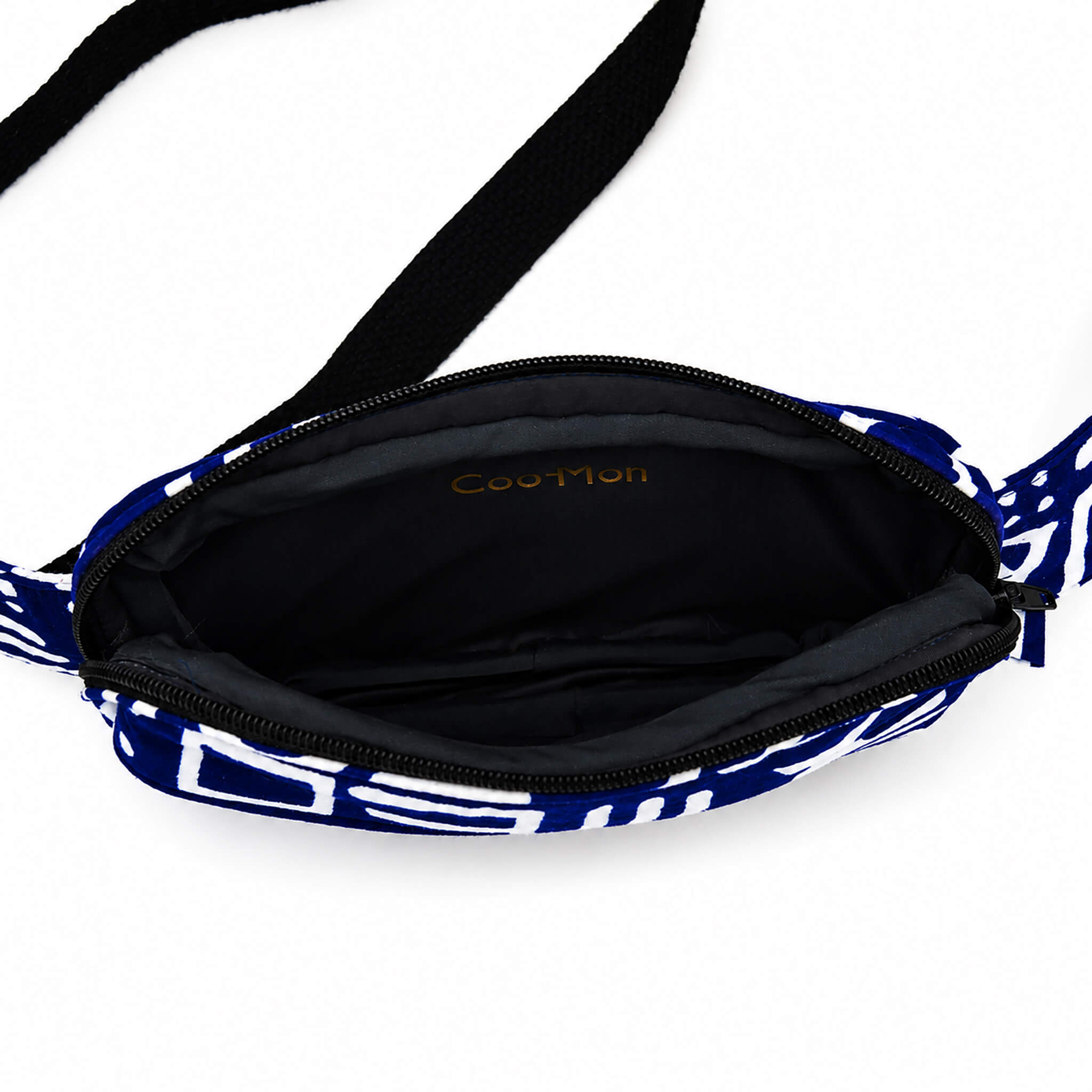 Intérieur du sac bandoulière convertible bleu et blanc avec grand compartiment principal zippé.