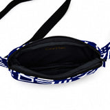 Intérieur du sac bandoulière convertible bleu et blanc avec grand compartiment principal zippé.