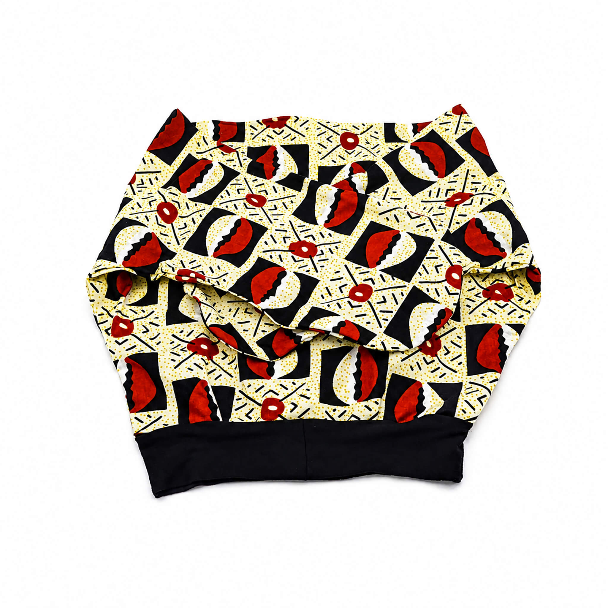 Turban en wax ocre, noir et crème avec fil métallique confectionné à Montréal par Coo-Mon